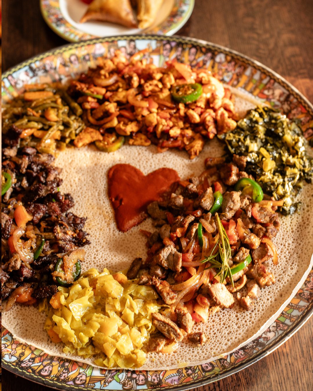 Classic Beef, Chicken, and Lamb tibs with your choice of three vegetable sides and starch.